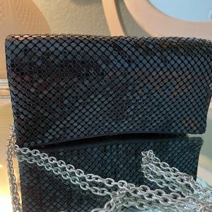 Brand new clutch bag with chrome chain to be wo n over shoulder